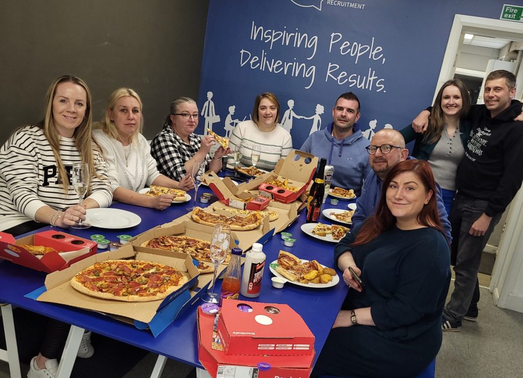 talk staff team eating pay day pizza as a benefit monthly