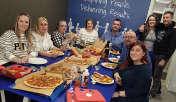 talk staff team eating pay day pizza as a benefit monthly