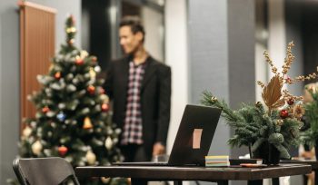 Festive office scene with recruiters, HR, and payroll celebrating Christmas.