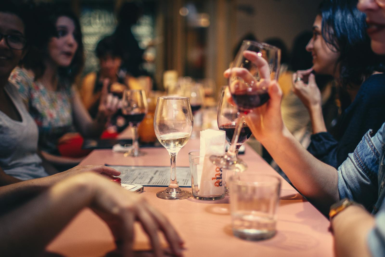 A festive dining scene with a waiter receiving a tip, symbolising the fair distribution of tips under the Employment (Allocation of Tips) Act 2023.